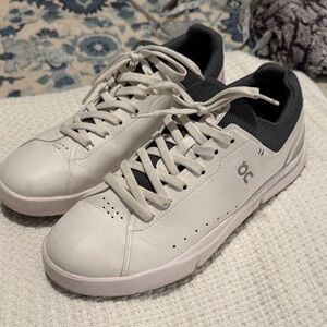 On Running White and Black Athletic Shoes